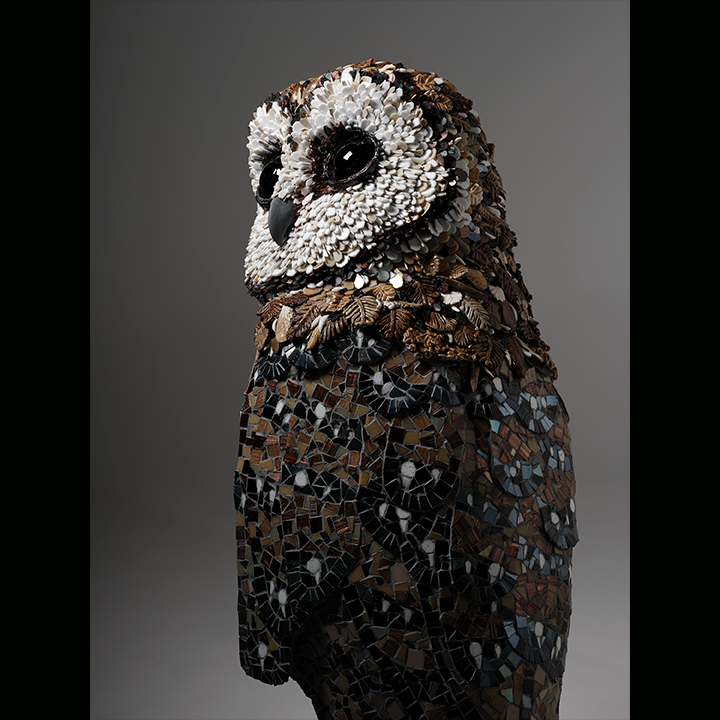 Wendy Edwards. Masked Owl (2024). Impressed Ceramic, fused glass, tile. 1.2mH x 60cmW